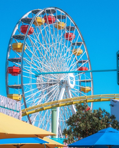 A Ferris wheel against a bright blue sky